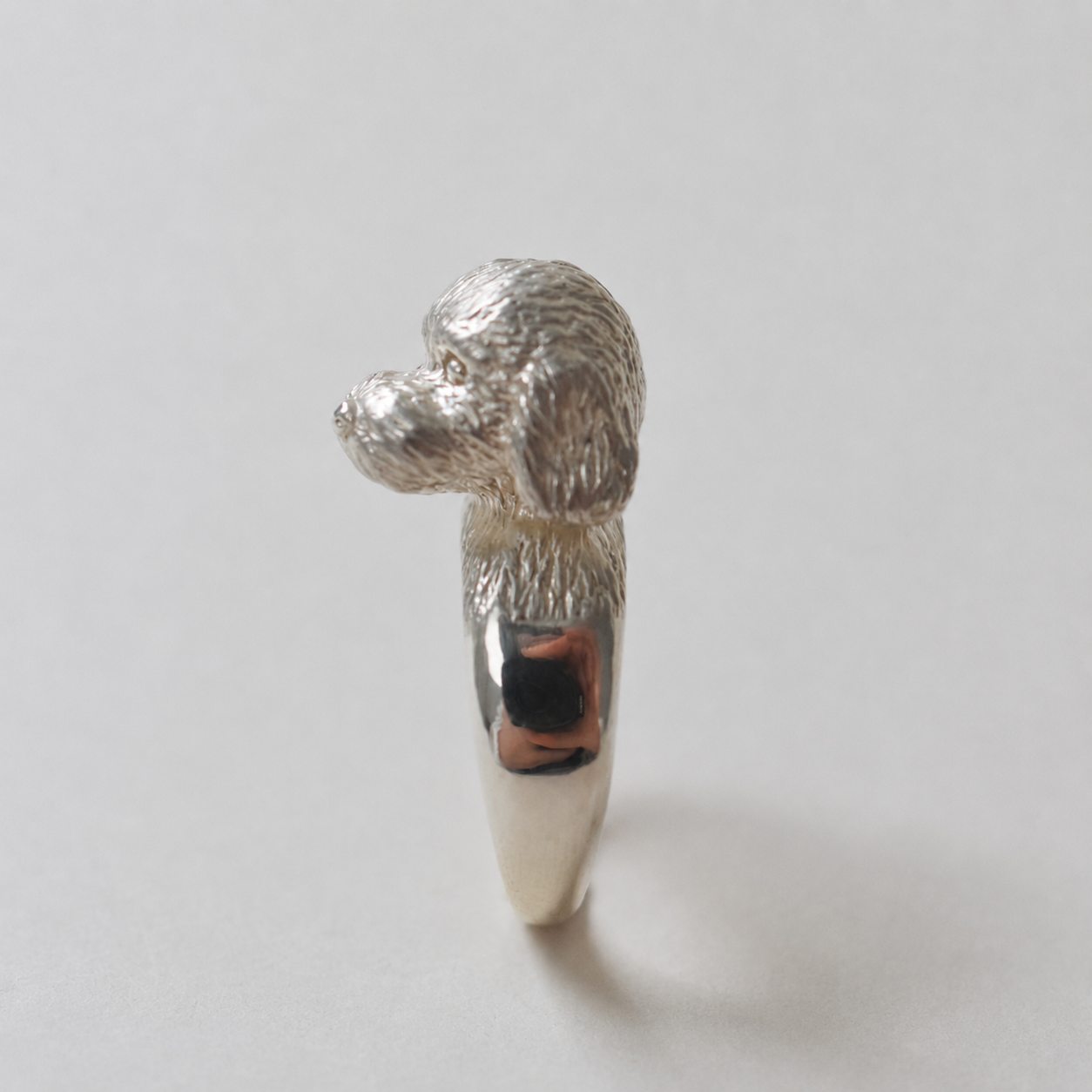 ring poodle face