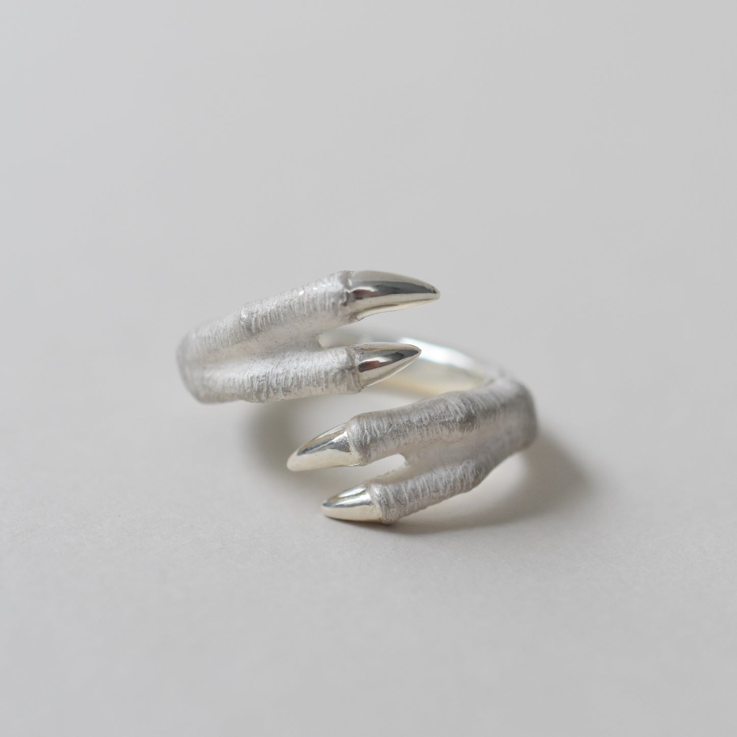 ring tyrannosaurs claw cross