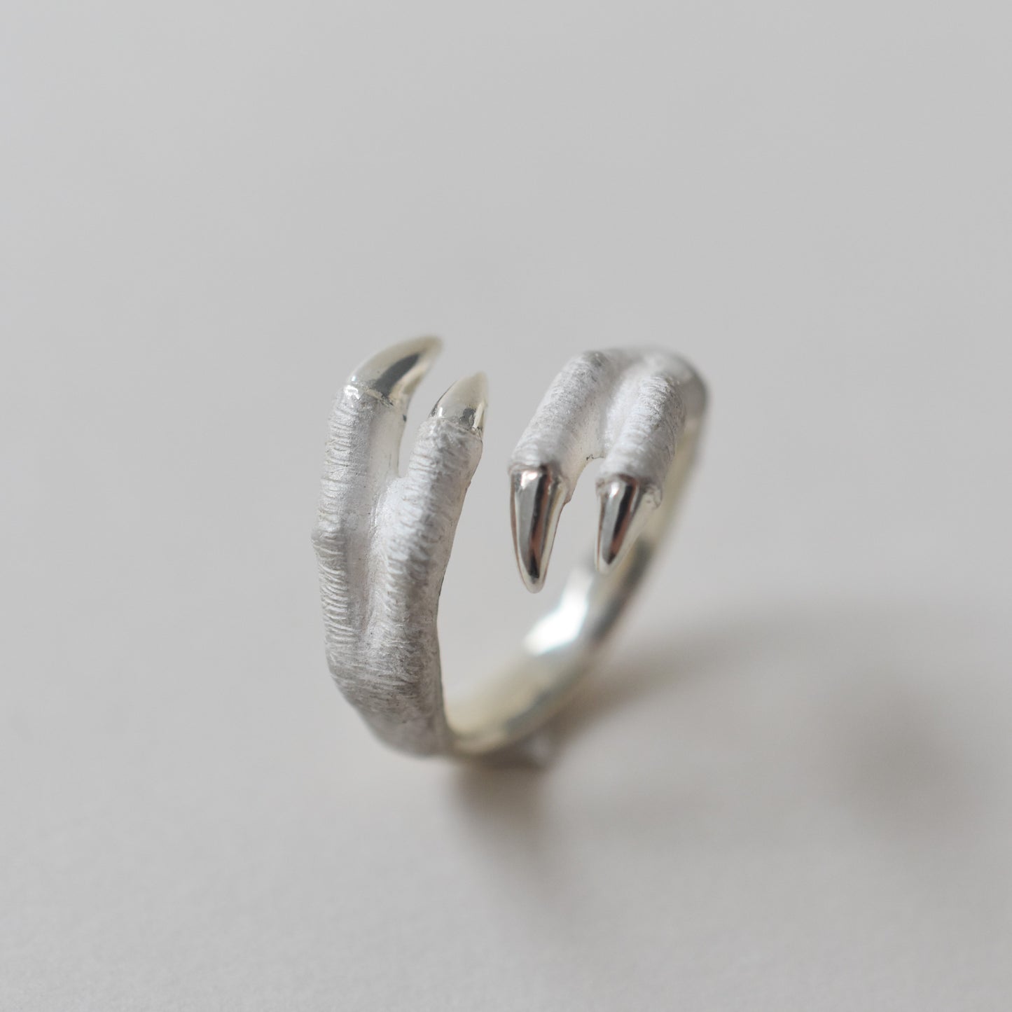 ring tyrannosaurs claw cross