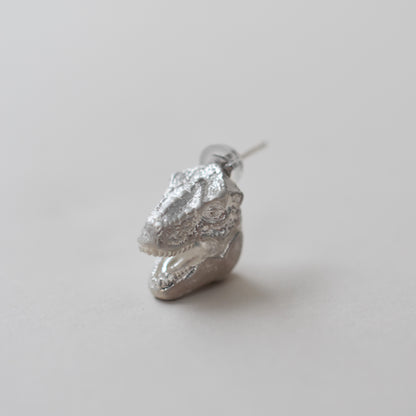 pierced earring tyrannosaurs face