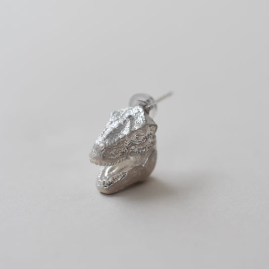 pierced earring tyrannosaurs face