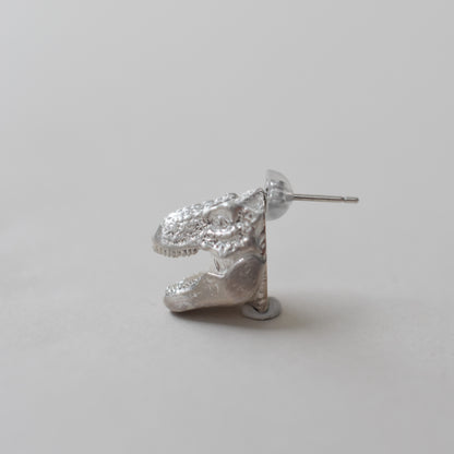 pierced earring tyrannosaurs face