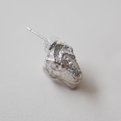 pierced earring tyrannosaurs face