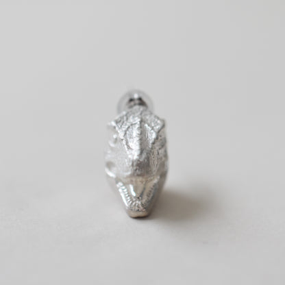 pierced earring tyrannosaurs face