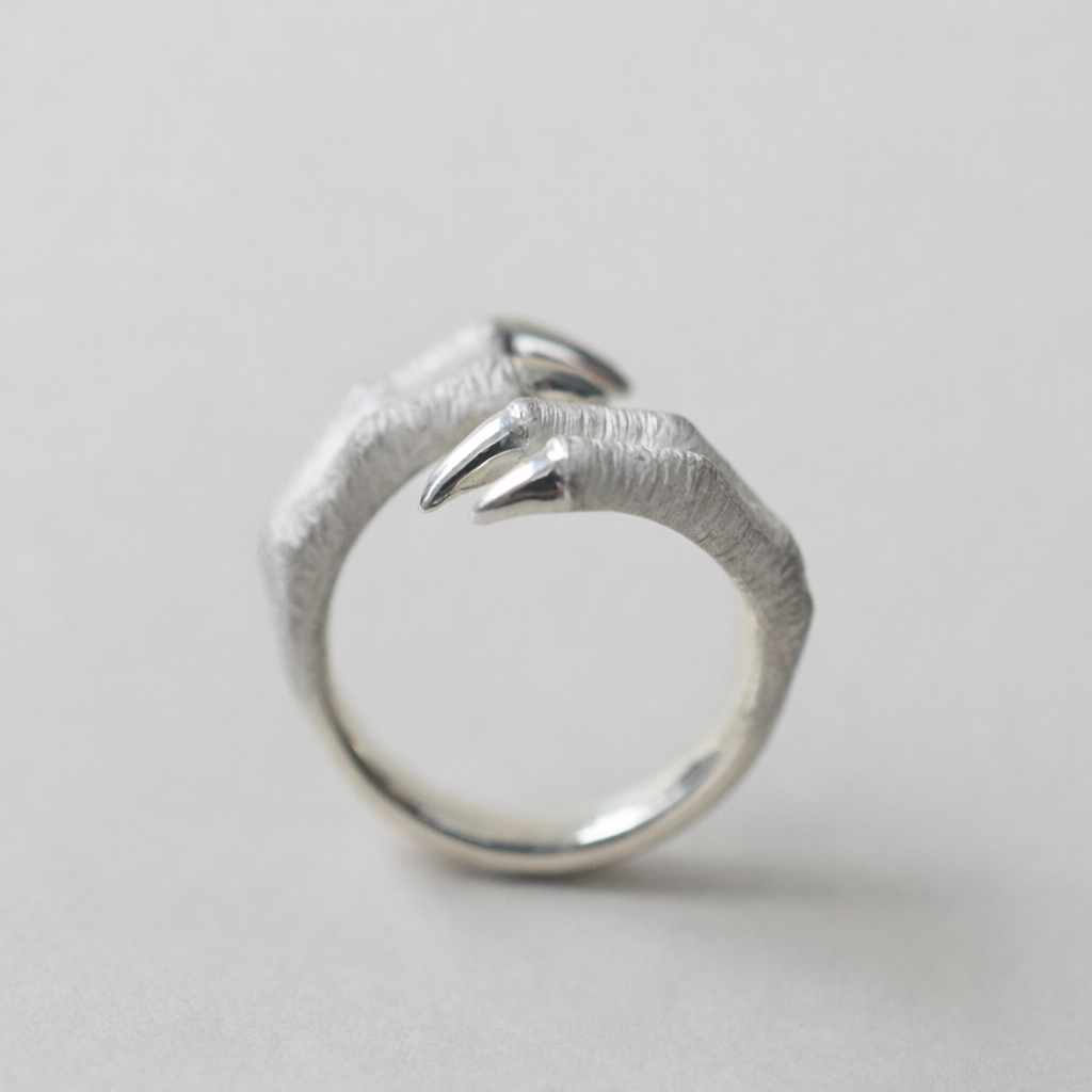 ring tyrannosaurs claw cross
