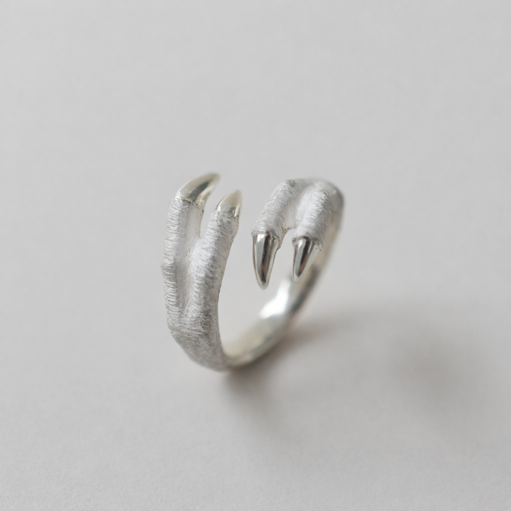 ring tyrannosaurs claw cross