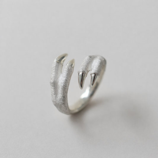 ring tyrannosaurs claw cross